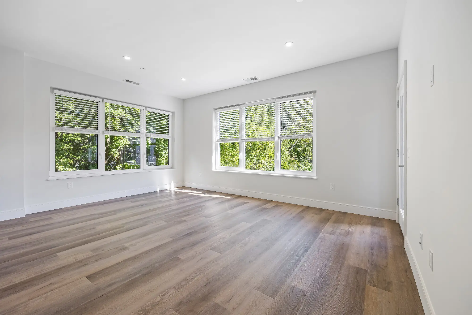 The Beacon apartment living room with large windows - Norwalk, CT