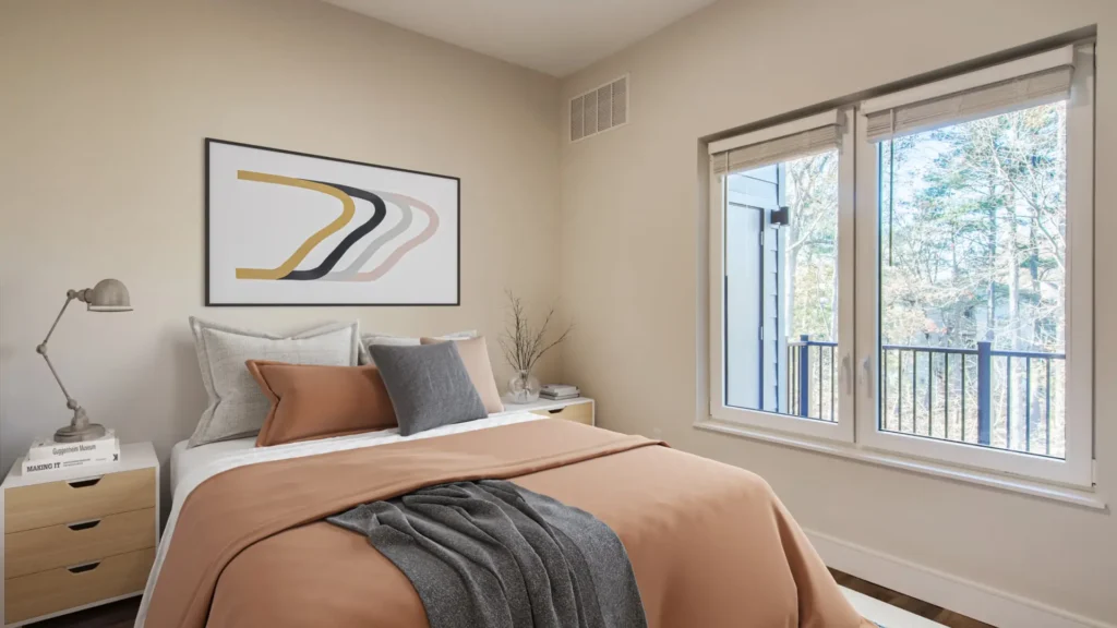 The Beacon furnished bedroom with window next to the balcony with a storage closet